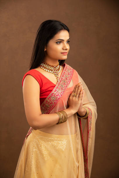 istock Pretty Indian young woman praying 1270779793