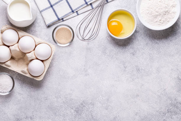 istock Ingredients for baking - flour, milk, salt, sugar, eggs. 1270782779