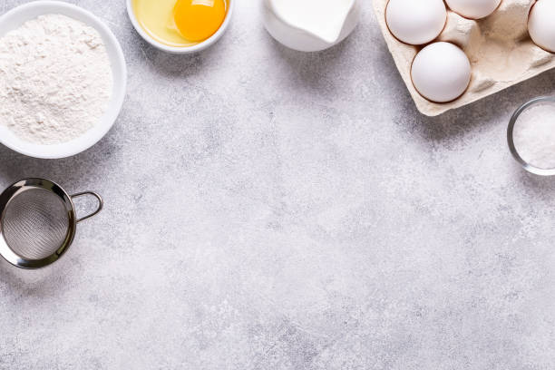 istock Ingredients for baking - flour, milk, salt, sugar, eggs. 1270783380