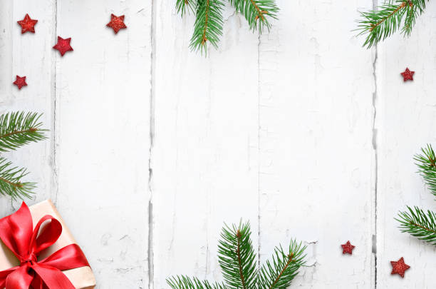 istock Fir branch and gift on white wooden background with copy space for text. Christmas concept. 1270785482