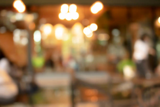 istock abstract blur of interior inside coffee cafe shop background with light effect for design element. Blurred cafe background with bokeh. orange ,red, light. 1270789556