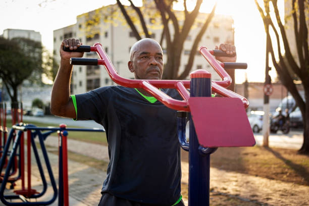 istock Senior man exercising at a public park. 1270793689