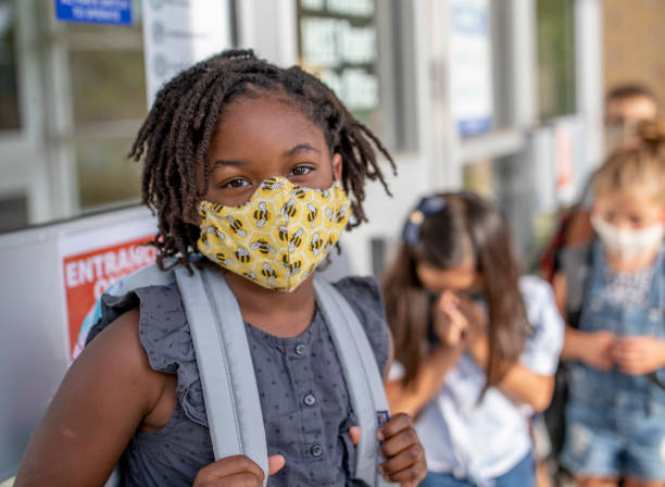 istock Diverse group of elementary school kids go back to school wearing masks 1270794776