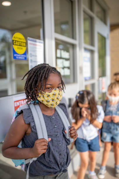 istock Diverse group of elementary school kids go back to school wearing masks 1270794781