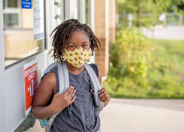 istock Diverse group of elementary school kids go back to school wearing masks 1270794786