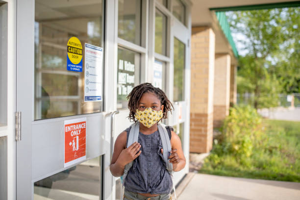 istock Diverse group of elementary school kids go back to school wearing masks 1270794793