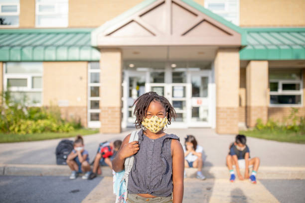istock Diverse group of elementary school kids go back to school wearing masks 1270794809