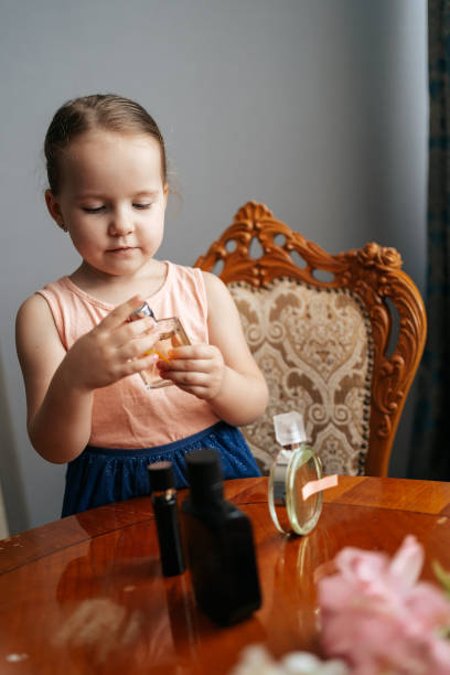 istock Little girl dreams to become a perfumer 1270798137