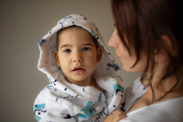 istock Mother holds her little son in her arms 1270799484