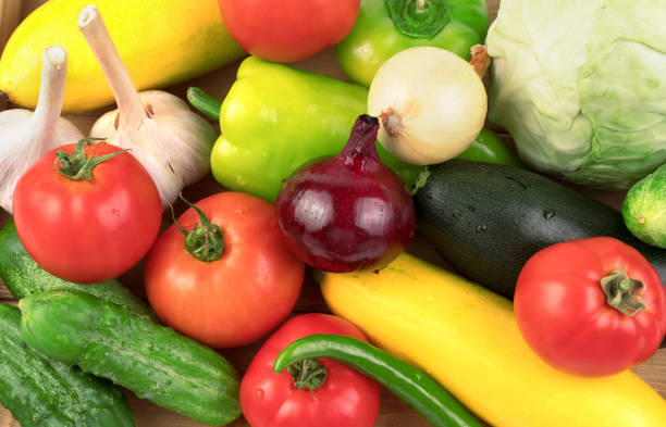 istock Washed fresh vegetables in large quantities on a white background with water drops. 1270802511