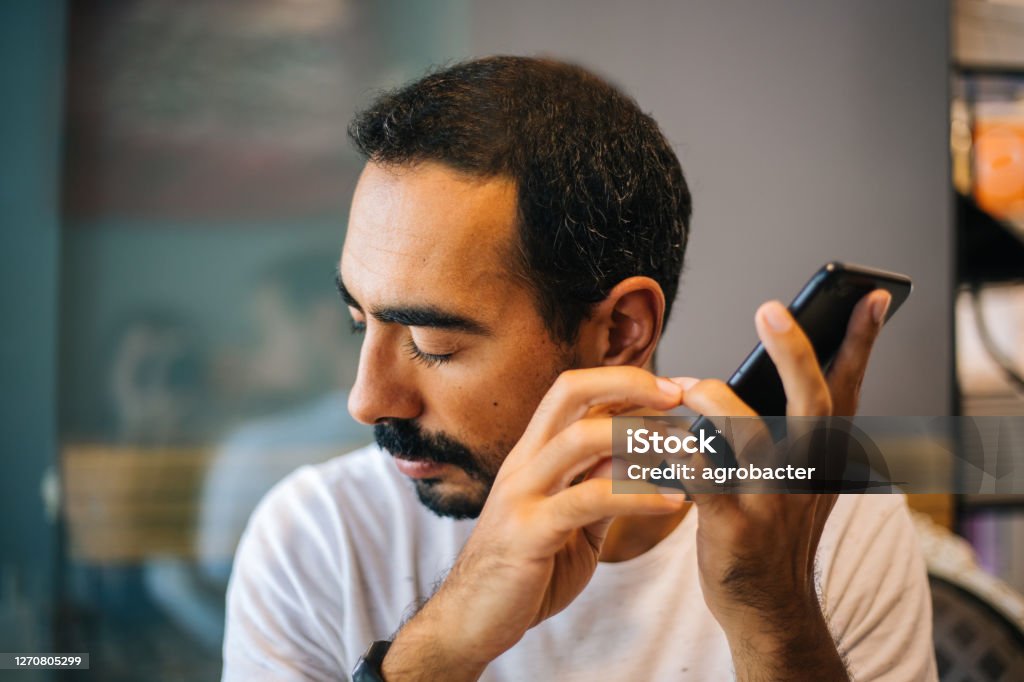 Blind man using technology Accessibility Stock Photo
