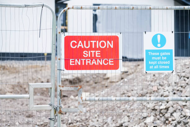 istock Construction building site sign at entrance on gate 1270812610