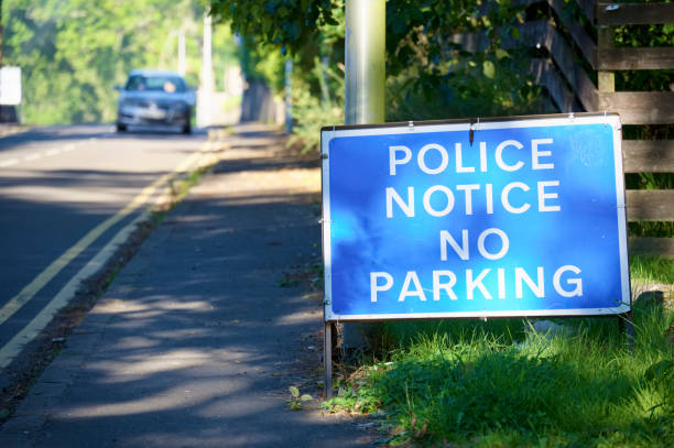 istock Police notice no parking blue road sign 1270812776