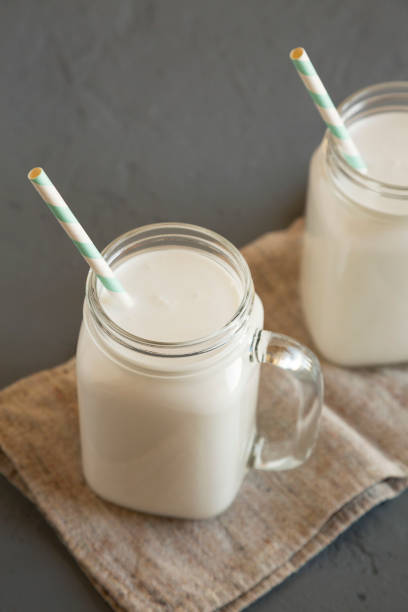 istock Coconut milk in glass jars, low angle view. Close-up. 1270814030
