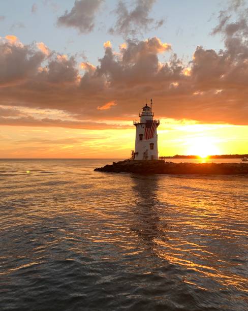 Old Saybrook lighthouse at sunset. stock photo