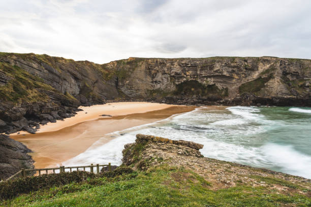 istock Antuerta beach with waves in Cantabria, Spain 1270819635