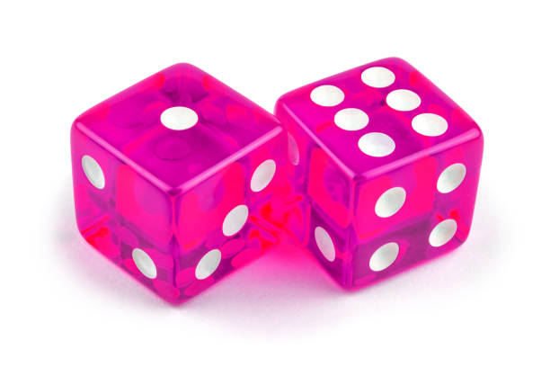 istock Two pink professional game dice closeup isolated on a white background / one and six with a light shadow. 1270820252