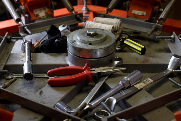istock working tools in the middle of print screening apparatus. serigraphy production. printing images on t-shirts in a design studio. 1270820812