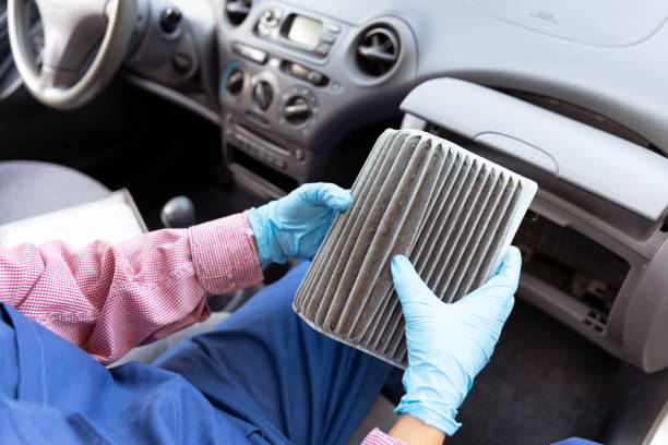istock Replacement of dirty cabin pollen air filter for a car 1270822009