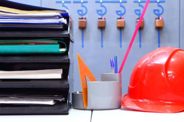 istock Industrial interior. Helmet, documents, office supplies. Industrial engineering 1270822270