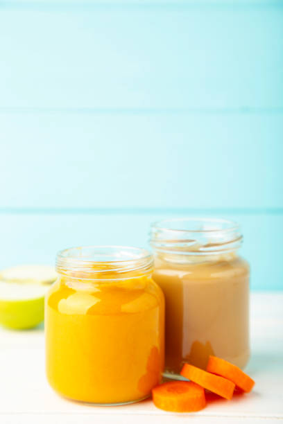 istock Assortment of vegetable and fruit puree on blue 1270823799