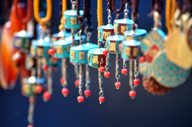 istock Buddhist prayer wheel earings. 1270825029