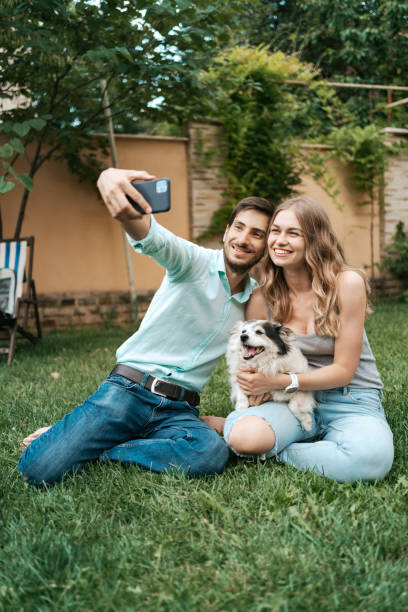 istock Young couple making selfie with their lovely dog 1270832788