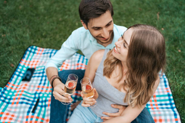 istock Couple drinking sparkling wine with strawberries 1270832812
