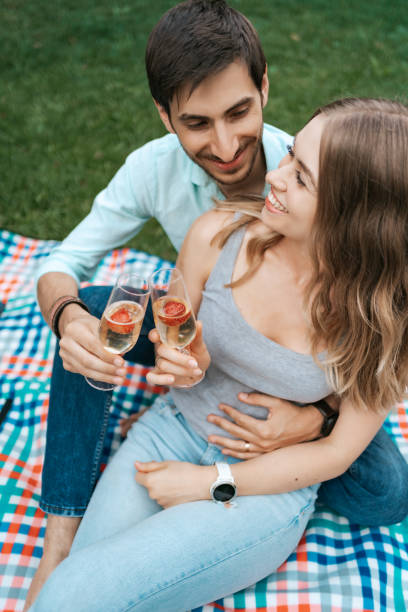 istock Couple drinking sparkling wine with strawberries 1270832817