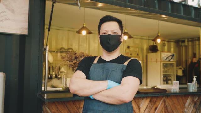 Food truck owner wearing protective face mask