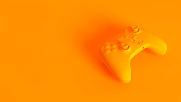 konzeptuelles isometrisches bild. gamepad vollständig in orange farbe getönt. - spielsteuerung fotos stock-fotos und bilder