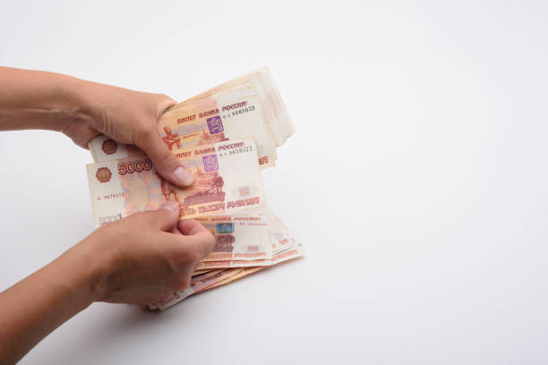 istock Hands count money in a bundle of five-thousandth Russian bills 1270835587