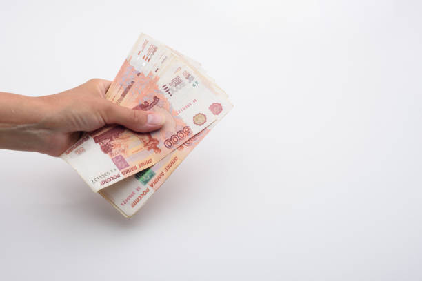 istock Hand holds a bundle of Russian five thousandth bills 1270835595