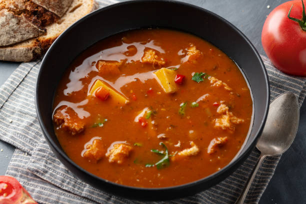 istock Goulash soup with vegetables and meat served in bowl on table. 1270837276
