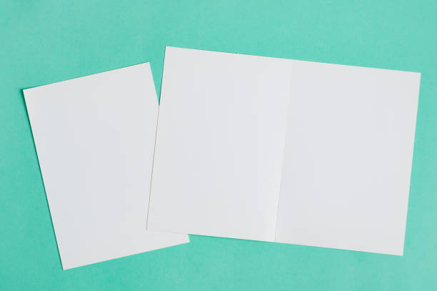 istock Blank mock-up paper letters for writing messages or text on a pastel turquoise background. 1270839905