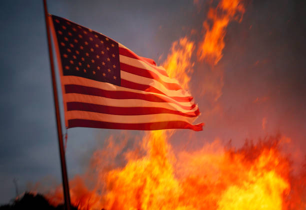 The United States burning Flag of the USA and fire behind riot photos stock pictures, royalty-free photos & images