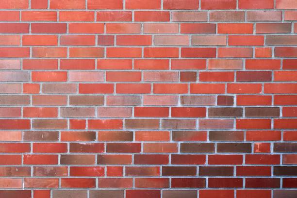 istock Old brick wall. Texture of old weathered brick wall panoramic background 1270841048