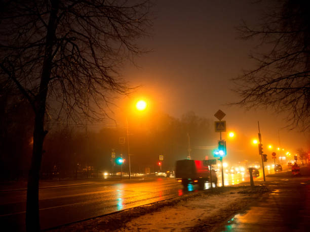 istock intersection with traffic lights in winter at night 1270844300