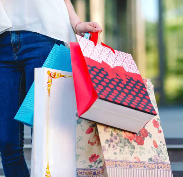 istock A girl with shopping bags in hands. 1270844314