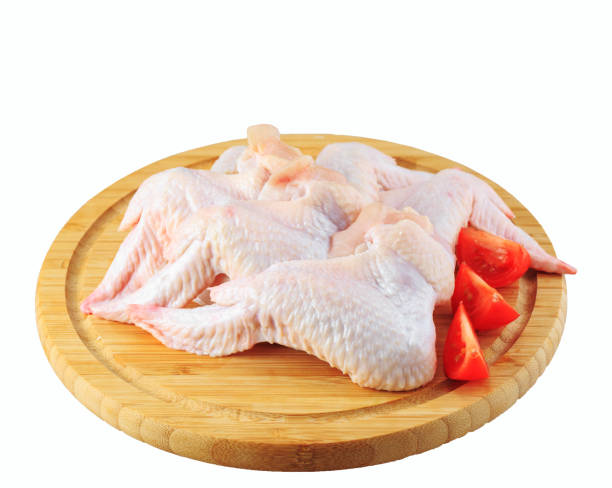 istock raw chicken wings on a wooden board on white background 1270845408