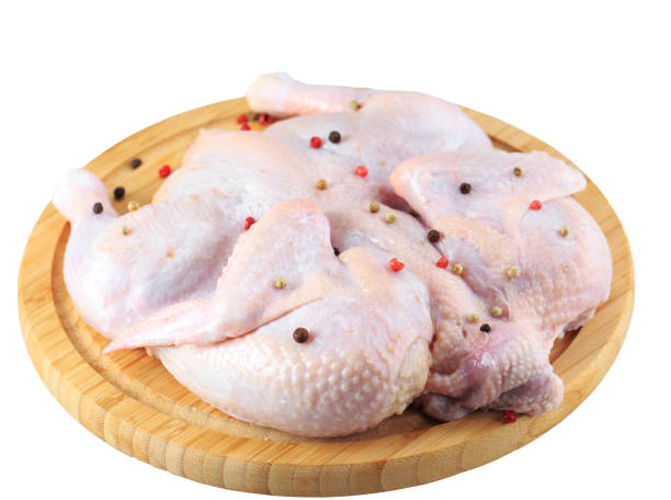 istock raw chicken carcass on the cutting board isolated on white background. 1270845439