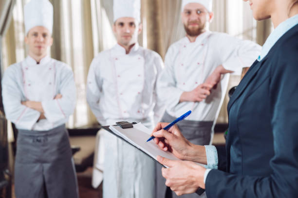istock restaurant manager and his staff in kitchen. interacting to head chef in commercial kitchen 1270846825