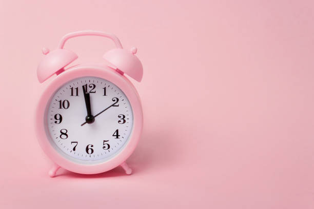istock Pink alarm clock on pink background top view Flat lay copy space. Minimalistic background, concept of time, deadline, time to work, morning. 1270847117
