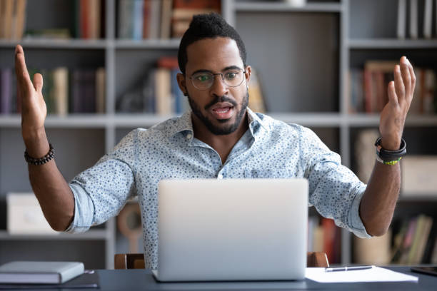 istock Irritated angry African American man having problem with laptop 1270850601