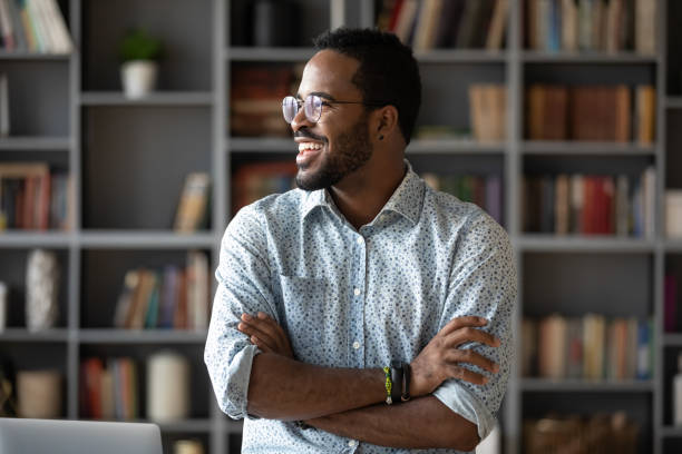 istock Smiling African American man wearing glasses dreaming and visualizing 1270850636