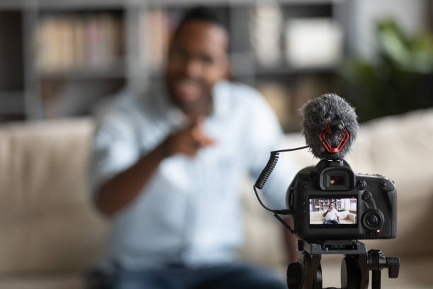 istock Close up African American blogger using digital camera, recording vlog 1270851163