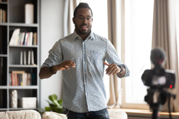istock African American man shooting video, popular blogger using digital camera 1270851166