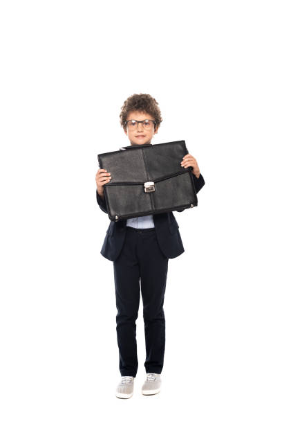 istock curly boy in formal wear and glasses holding briefcase isolated on white 1270853253