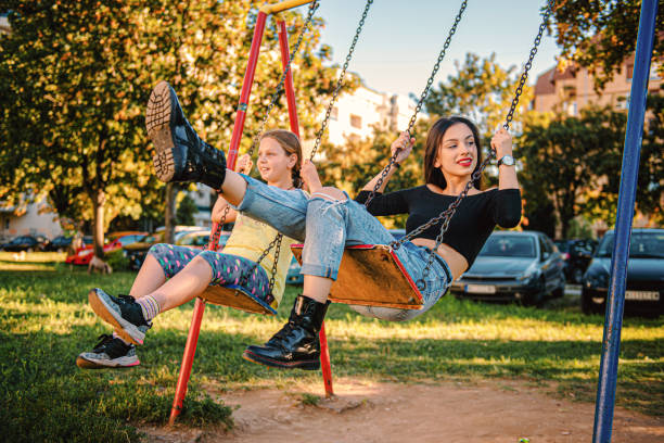 istock Girls enjoying on swing 1270856121