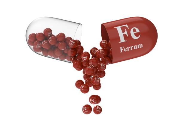 istock Open capsule with ferrum from which the vitamin composition is pouring 1270859849